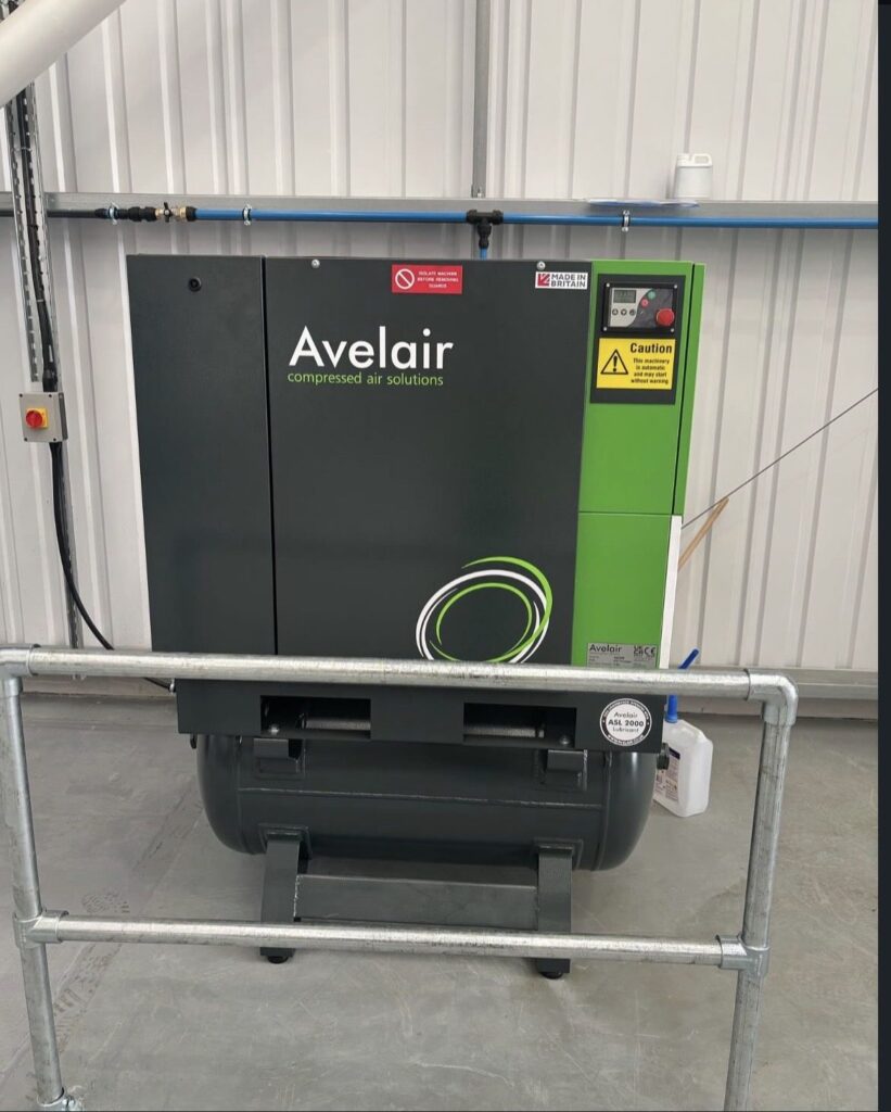 British-made Avelair rotary screw compressor and air receiver installed in a workshop